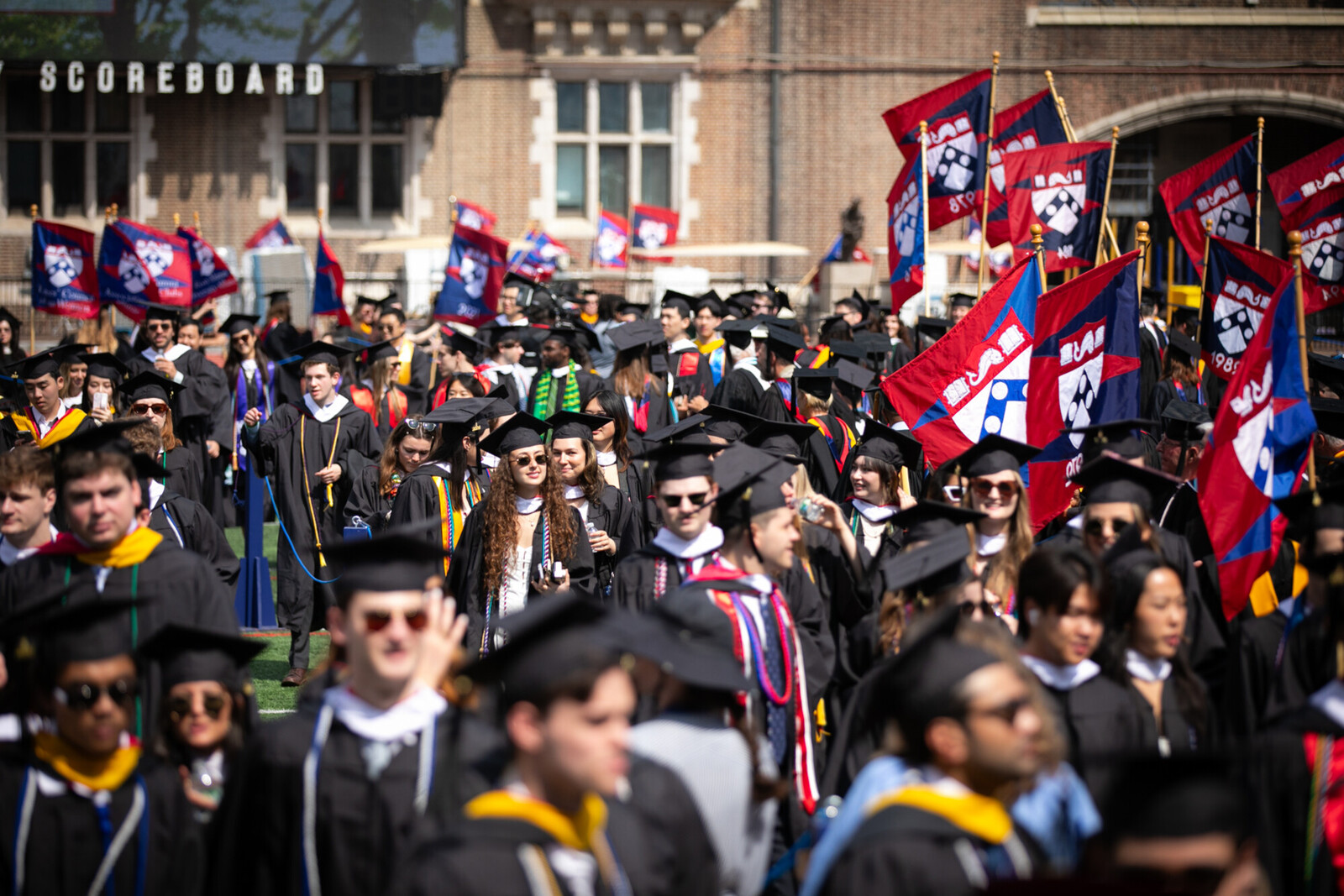 graduates gather at franklin field for commencement