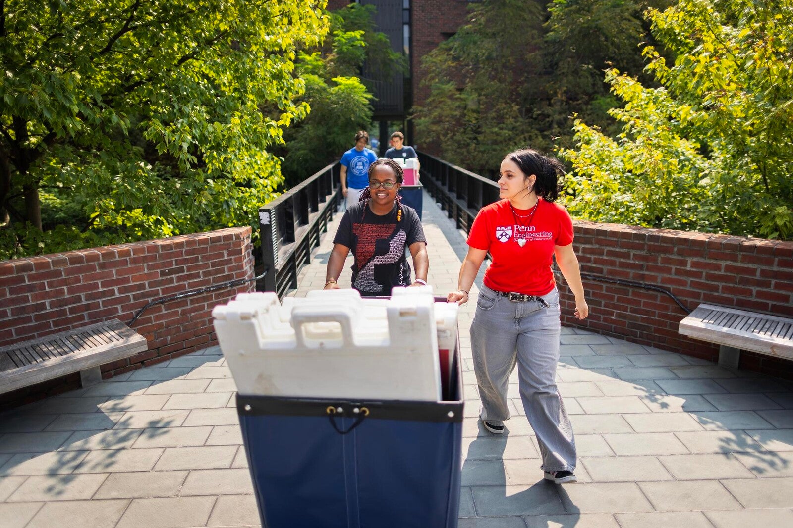 Move-In coordinators preparing for incoming residents at Hill College House