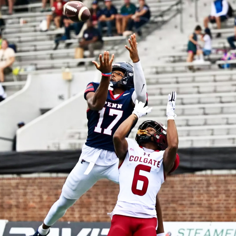 Third-year wide receiver Jared Richardson jumping over Colgate defender to catch a touchdown pass.