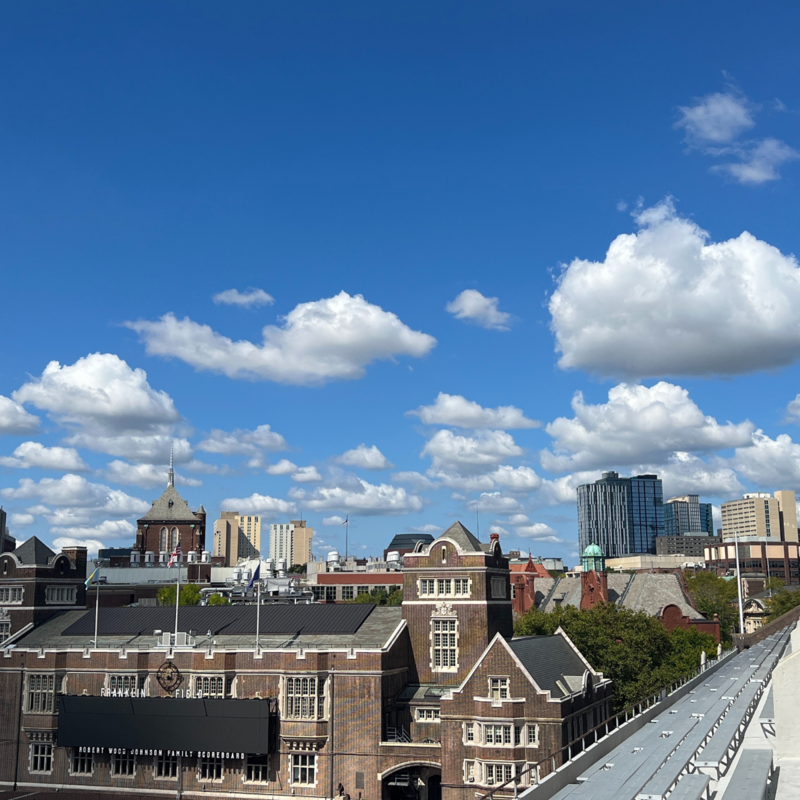 Blue sky and clouds above campus view from the upper deck of Franklin Field